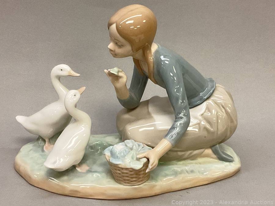 Lladro porcelain figurine of a woman with geese Auction