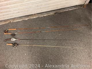 Four vintage fishing poles and reels Auction